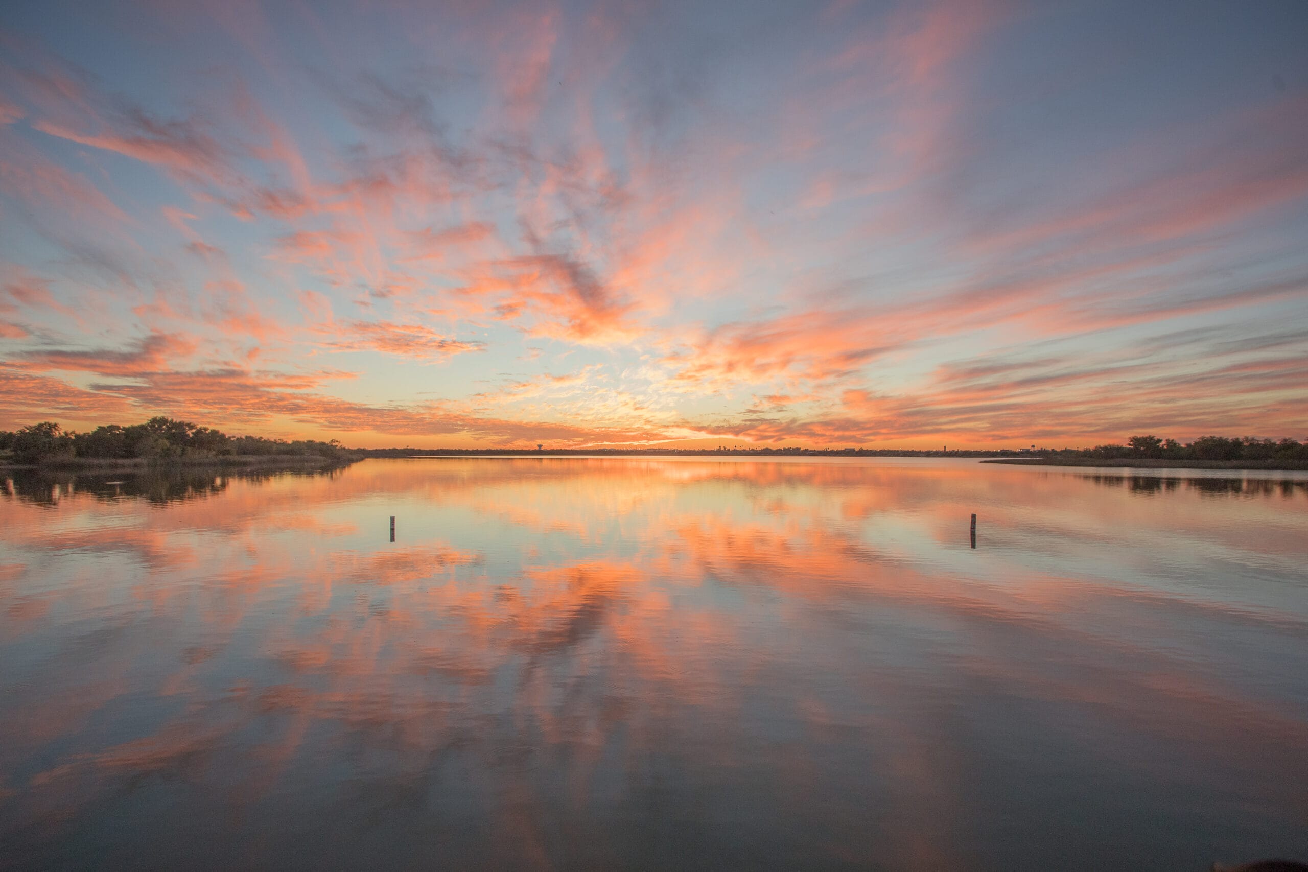 A colorful sunset reflected across Lake Casa Blanca in Laredo, Texas